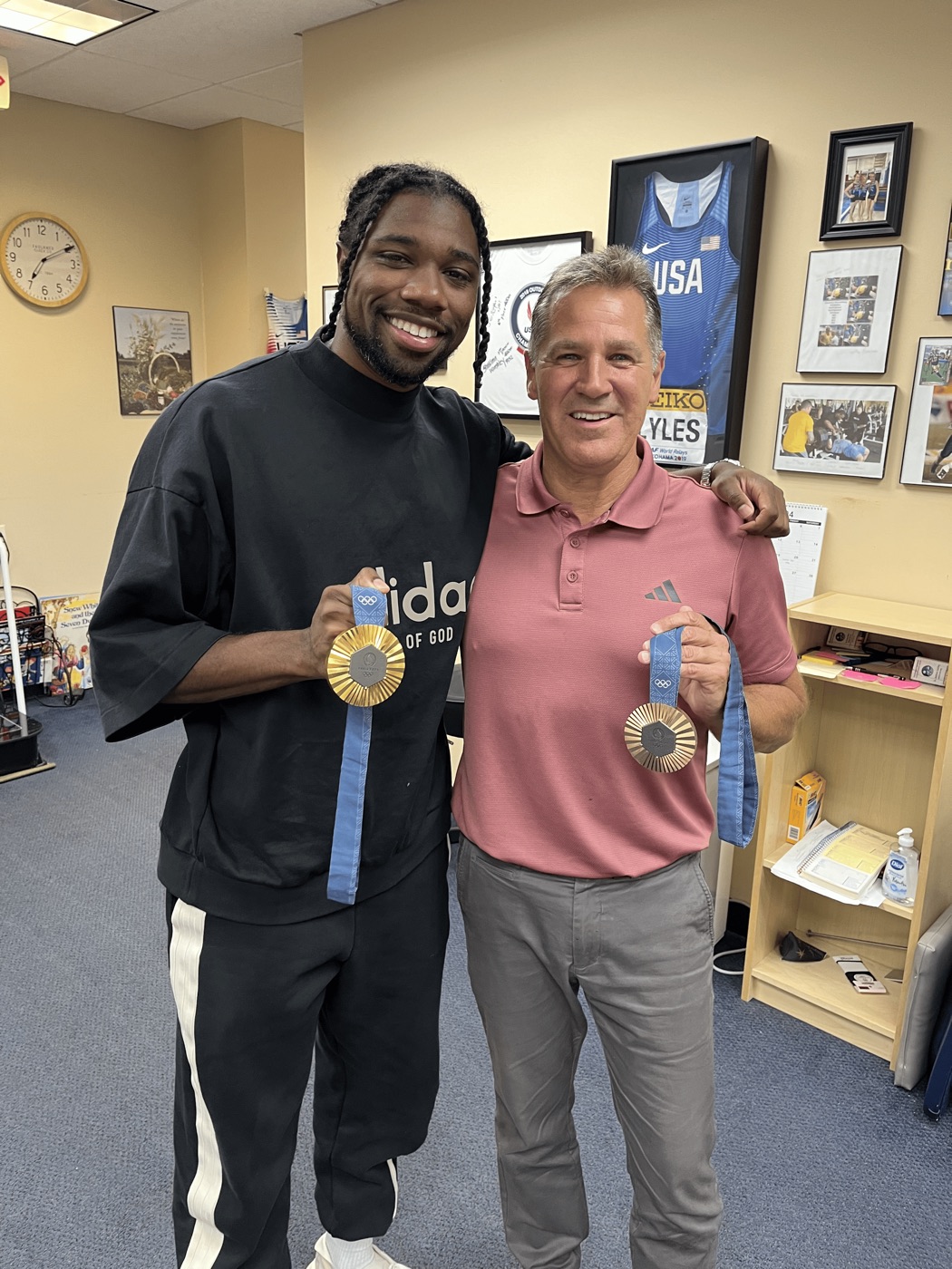 Dr. Obetz with Noah Lyles and his gold medals from the 2024 USA Olympic Trials